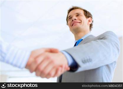 Business handshake. Close up image of business handshake at meeting. Partnership concept