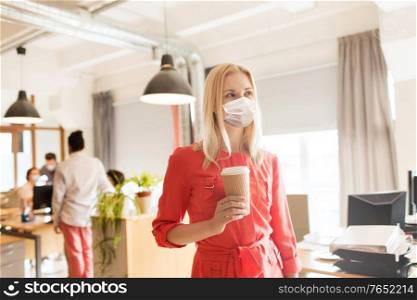 business, health and people concept - businesswoman or creative female office worker wearing face protective medical mask for protection from virus disease with takeaway coffee cup. female office worker in mask with coffee cup