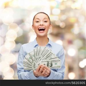 business, holidays and people concept - laughing businesswoman with dollar cash money
