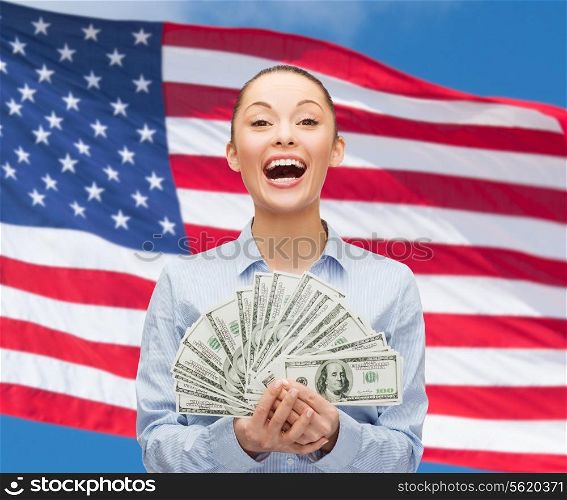 business, holidays and people concept - laughing businesswoman with dollar cash money over american flag background