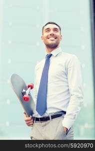 business, hot drinks and people and concept - young smiling businessman with skateboard outdoors