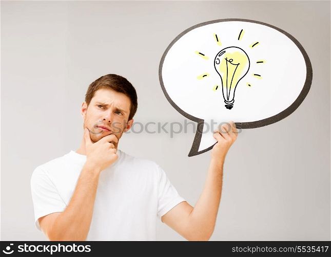 business idea concept - picture of thinking young man with ligth bulb in text bubble