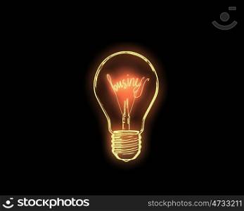 Business idea. Light bulb with concepts inside on dark background