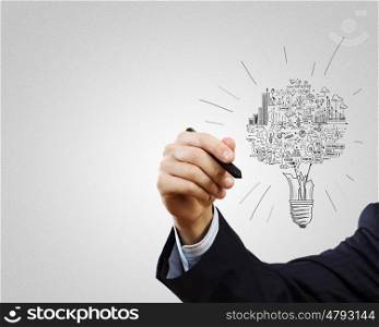 Business ideas. Close up of businessman hand drawing business strategy sketches