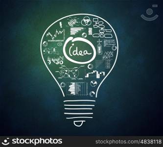 Business ideas. Conceptual image with drawn light bulb and business sketches