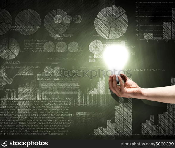 Business ideas. Conceptual image with light bulb diagrams and graphs