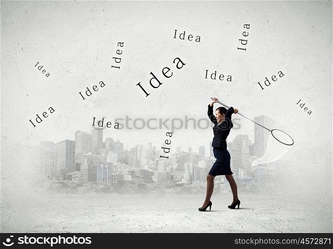 Business ideas. Young businesswoman catching word idea with hoop
