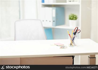 business, interior, workplace and education concept - stationery on office table