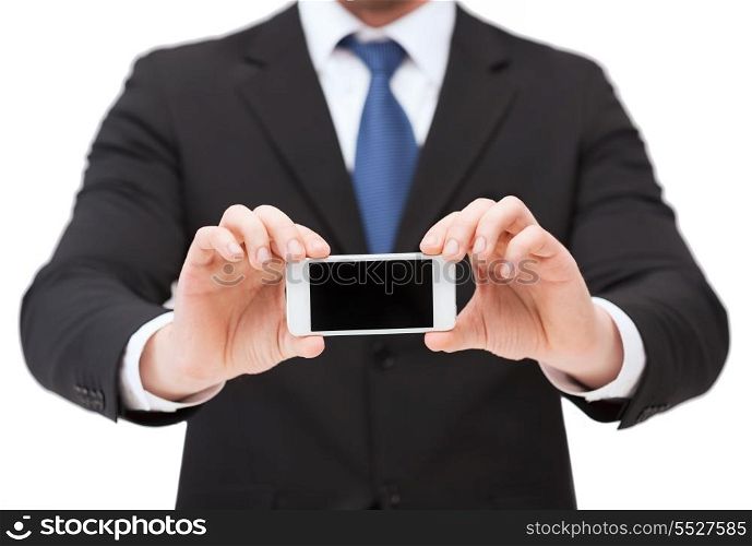 business, internet and technology concept - businessman showing smartphone with blank black screen