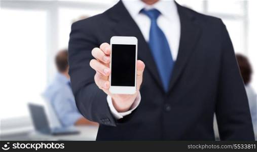 business, internet and technology concept - businessman showing smartphone with blank black screen