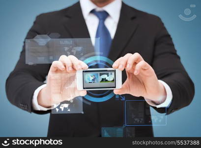 business, internet and technology concept - businessman showing smartphone with blank black screen