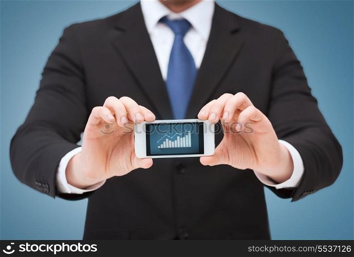business, internet and technology concept - businessman showing smartphone with graph on screen