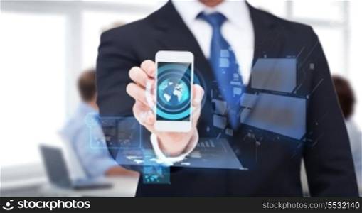 business, internet and technology concept - businessman showing smartphone with holograms