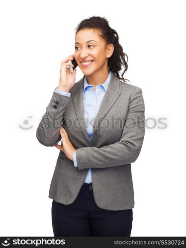 business, internet and technology concept - smiling african-american woman looking at smartphone