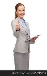 business, internet and technology concept - smiling woman looking at tablet pc computer showing thumbs up