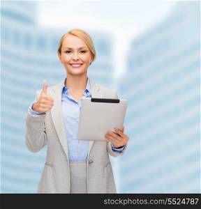 business, internet and technology concept - smiling woman with tablet pc computer showing thumbs up
