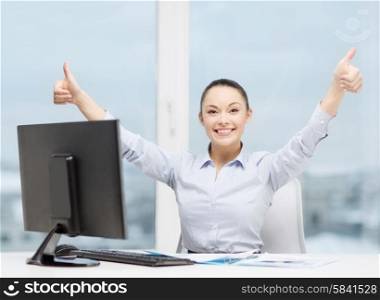business, internet, office and technology concept - smiling businesswoman with computer and paper showing thumbs up