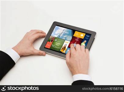 business, internet, people and technology concept - close up of man hands working with web pages on tablet pc computer screen