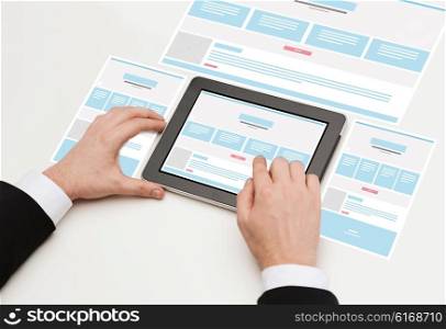 business, internet, web design and technology concept - close up of man hands touching tablet pc computer with web page design on screen