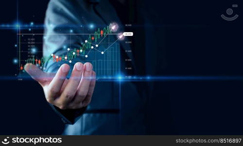 Business is growing. Businessman showing a graph of rising stocks. Shown in hand by holograms, startup, set business success goals, economic recovery, future technology, stock trading, online trading.