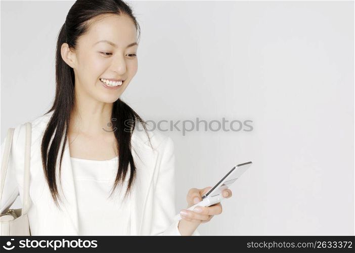 Business lady checking email of cell phone