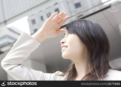 Business lady looking up to the sky