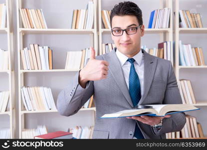 Business law student with magnifying glass reading a book