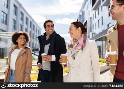 business, lifestyle and corporate concept - international group of people or friends with coffee on city street. group of people or friends with coffee in city