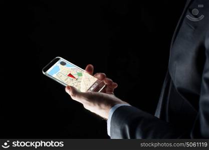 business, location, people and future technology concept - close up of businessman hand with transparent smartphone with gps navigator map on screen over black background. close up of businessman with gps map on smartphone