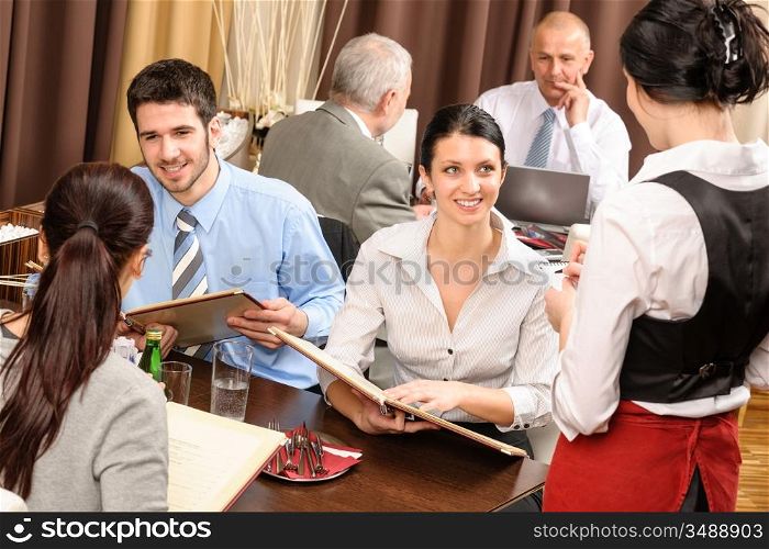Business lunch executive people looking menu waitress taking order restaurant