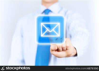 Business mail. Close up of businessman touching mail icon