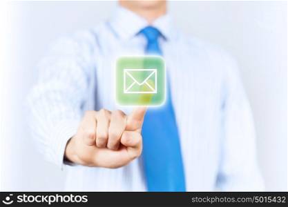 Business mail. Close up of businessman touching mail icon
