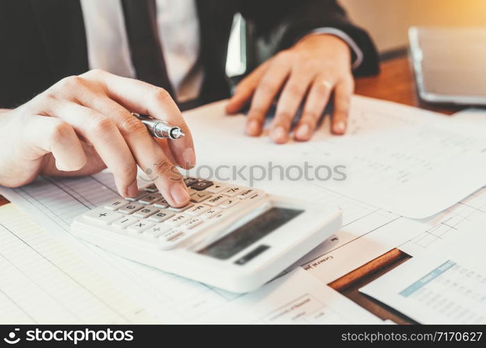 Business man Accounting Calculating Cost Economic budget investment and saving concept