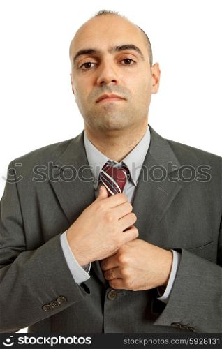 business man adjusting his tie isolated on white