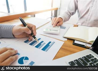 Business man analysis data document with accountant calculating about fee tax at a office