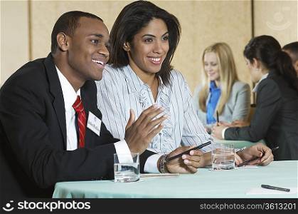 Business man and woman at conference meeting