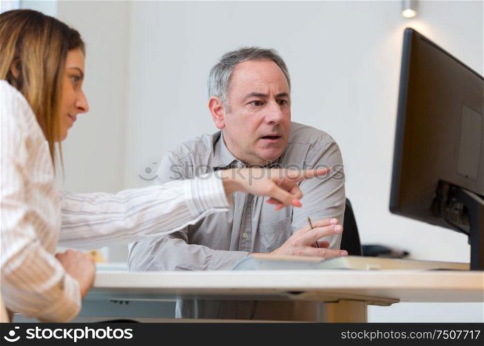 business man and woman with computer