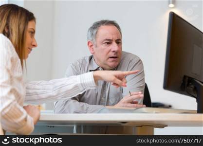 business man and woman with computer