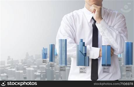 business man buy or sell modern building and real estate for investment