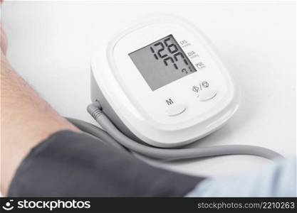 Business man check blood pressure and heart rate with Blood pressure gauge on white background , Health and Medical concept