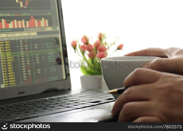 Business man checking stock diagram in office