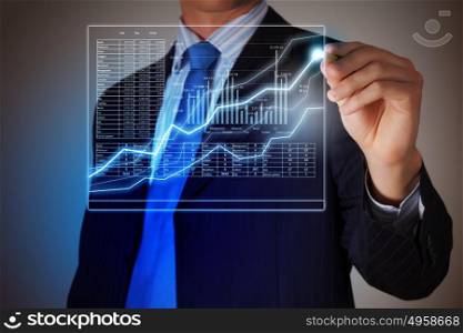 Business man drawing graphics. Closeup image of businessman drawing 3d graphics