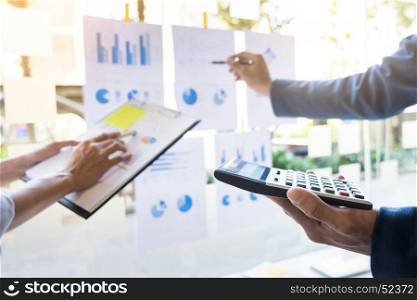 business man financial inspector and secretary making report, calculating or checking balance. Internal Revenue Service inspector checking document. Audit concept