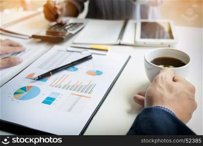 business man financial inspector and secretary making report, calculating or checking balance. Internal Revenue Service inspector checking document. Audit concept