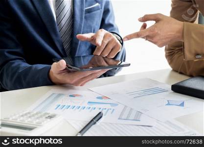business man financial inspector and secretary making report, calculating or checking balance. Internal Revenue Service inspector checking document. Audit concept at working with plan on office.