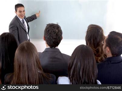business man giving a presentation to his employees