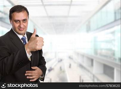 business man going thumb up at the office
