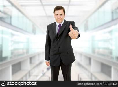 business man going thumb up at the office