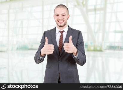 business man going thumbs up at the office