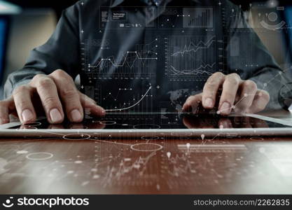 business man hand working on laptop computer with digital layer business strategy and social media diagram on wooden desk